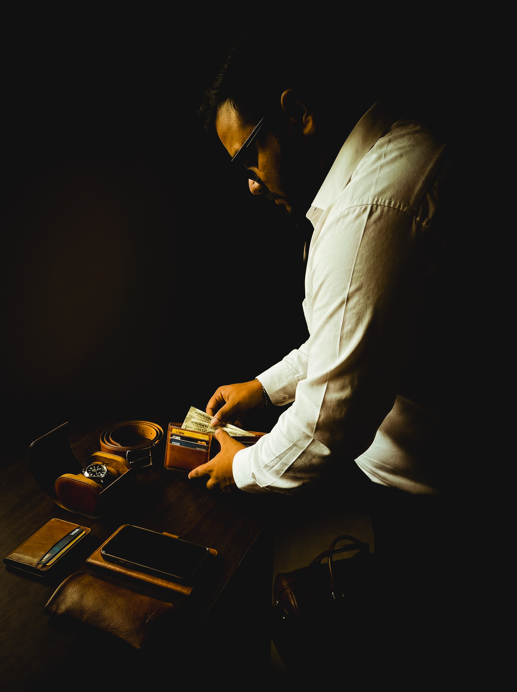 The Departure — leather bag, wallet and travel objects before leaving